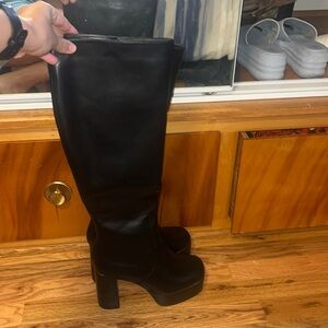 Knee length tall black boots